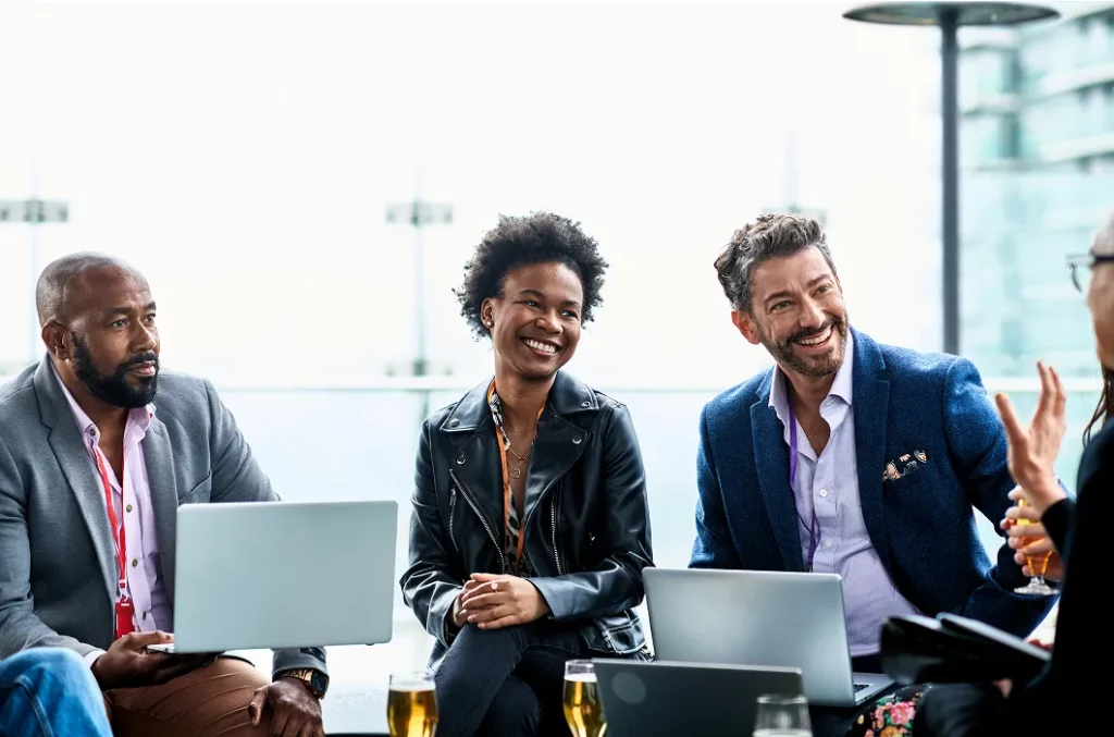 Happy employees discussing growth